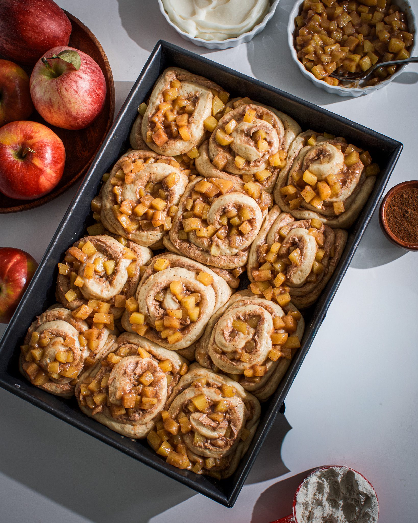 Proofed apple pie cinnamon rolls ready for baking