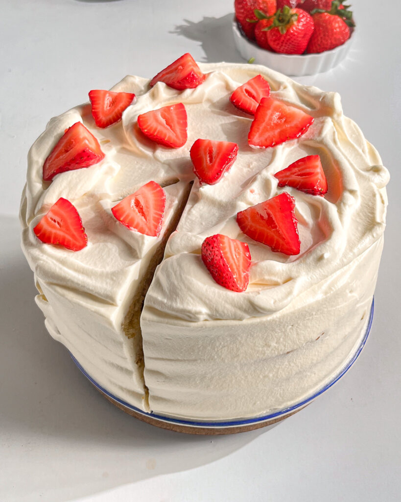 Eggless strawberry and cream cake with fresh strawberries