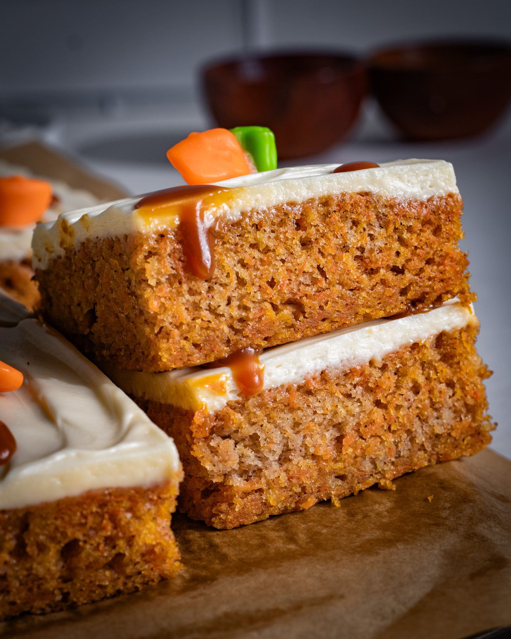 carrot sheet cake topped with smooth frosting close up