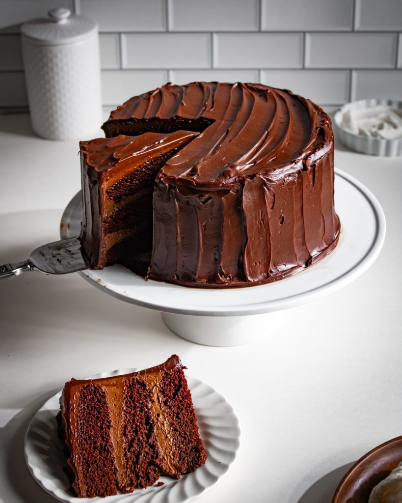 eggless triple chocolate cake slice with ganache