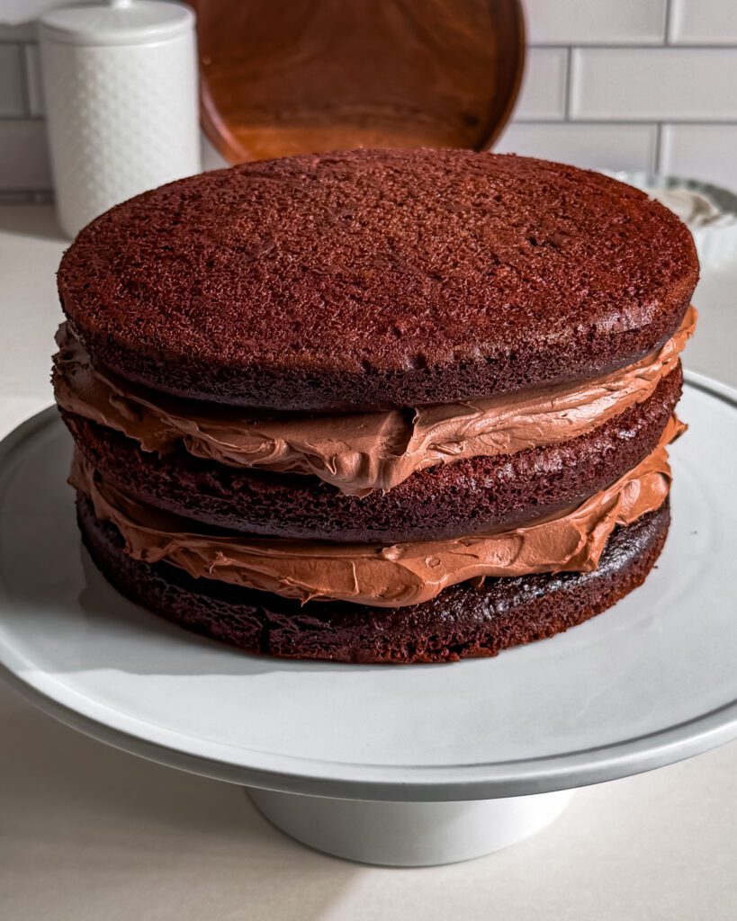 triple chocolate cake eggless moist layers