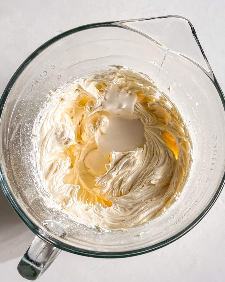 Adding whipping cream to loosen buttercream texture