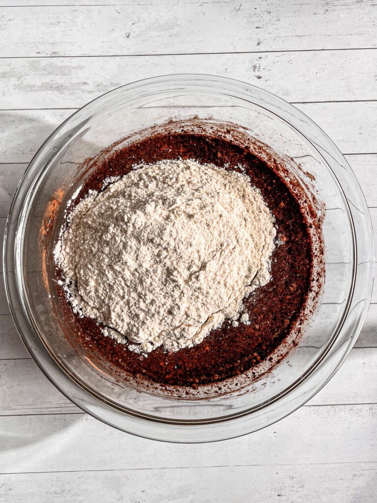 Dry ingredients for eggless dairy-free chocolate cupcakes in a mixing bowl