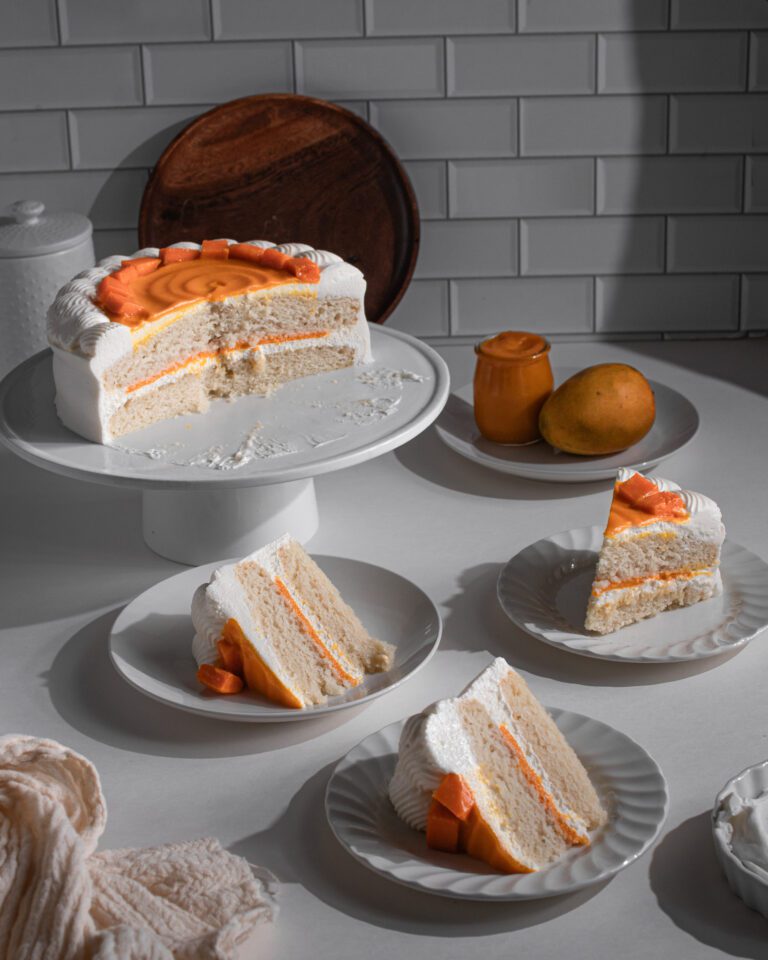 Creamy bakery style mango layer cake served chilled