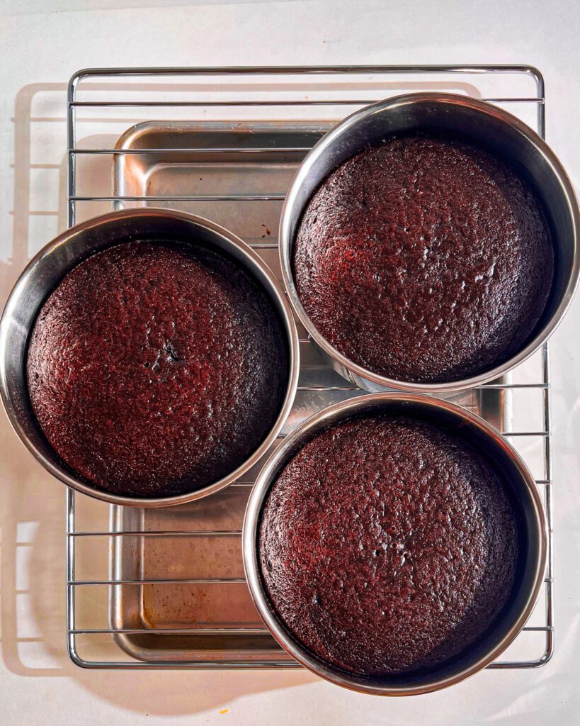 Eggless chocolate cake layers cooling on wire rack