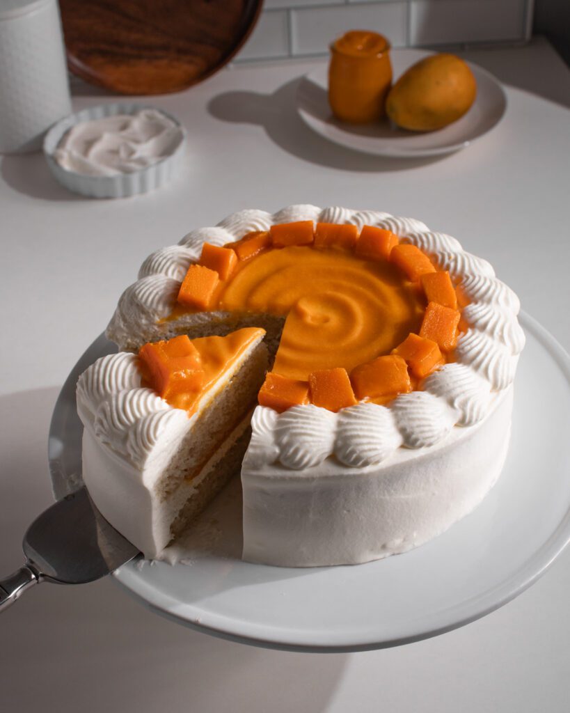 Fresh mango cream cake with soft sponge layers
