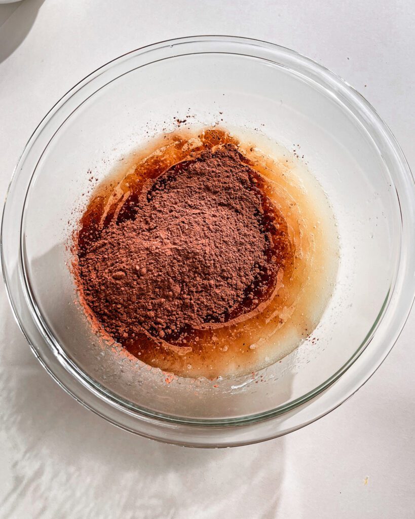 Mixing cocoa powder into chocolate cake batter