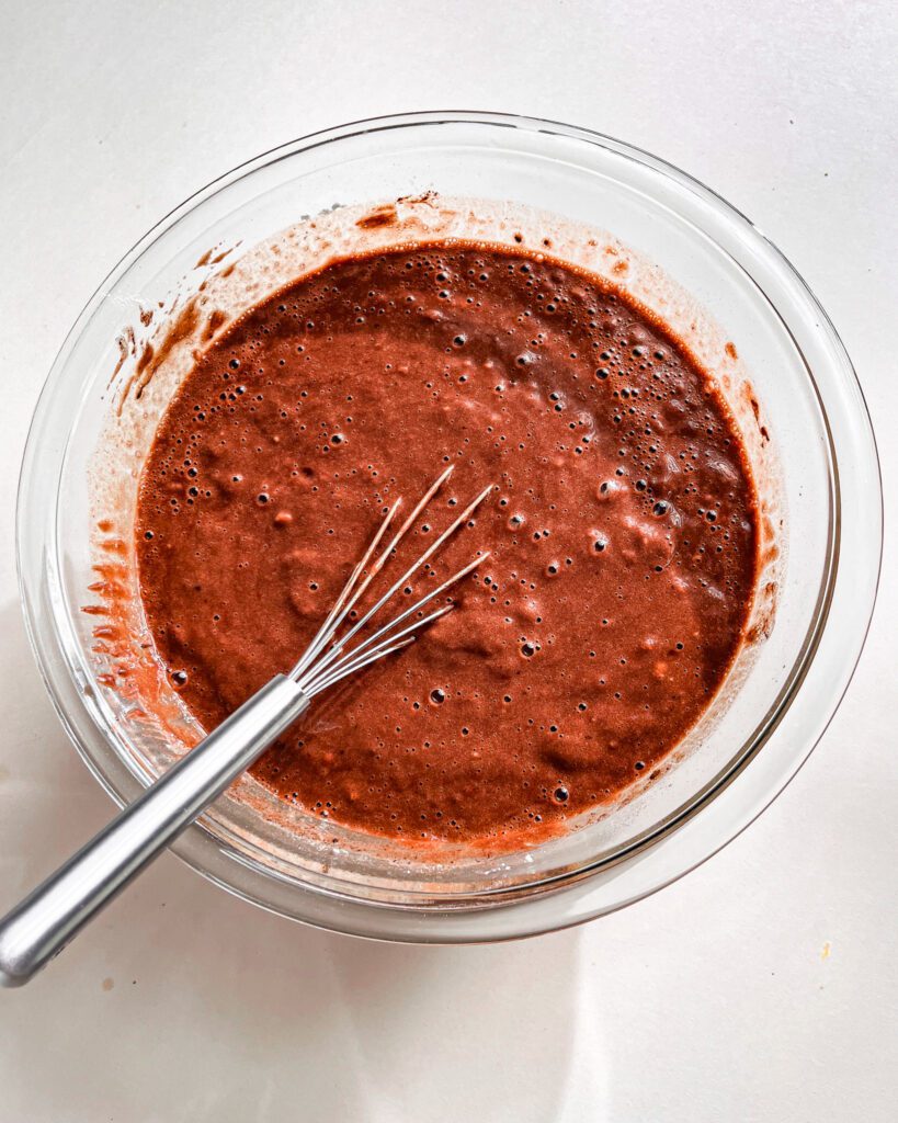 Smooth eggless chocolate cake batter ready for baking
