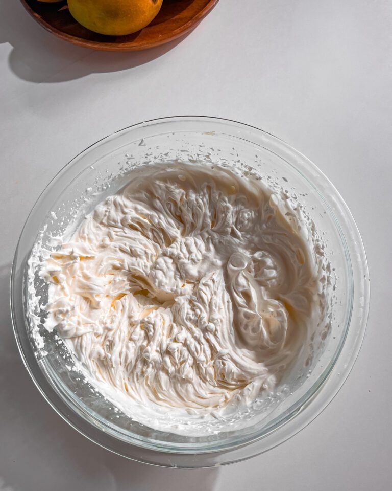 Smooth whipped cream frosting for mango cake
