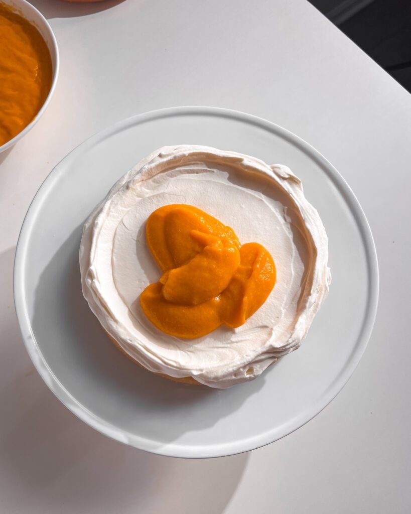 Spreading eggless mango curd with offset spatula jpg