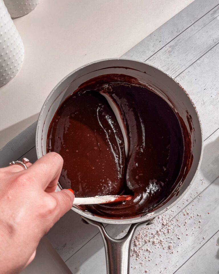 mixing fudge glaze cake topping