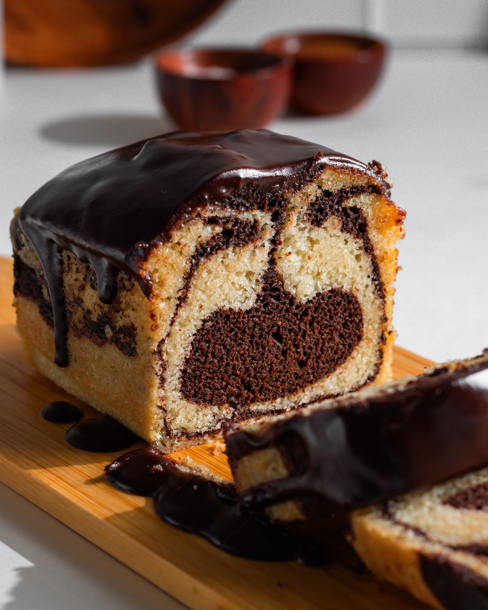 Eggless marble loaf cake with chocolate and vanilla swirls