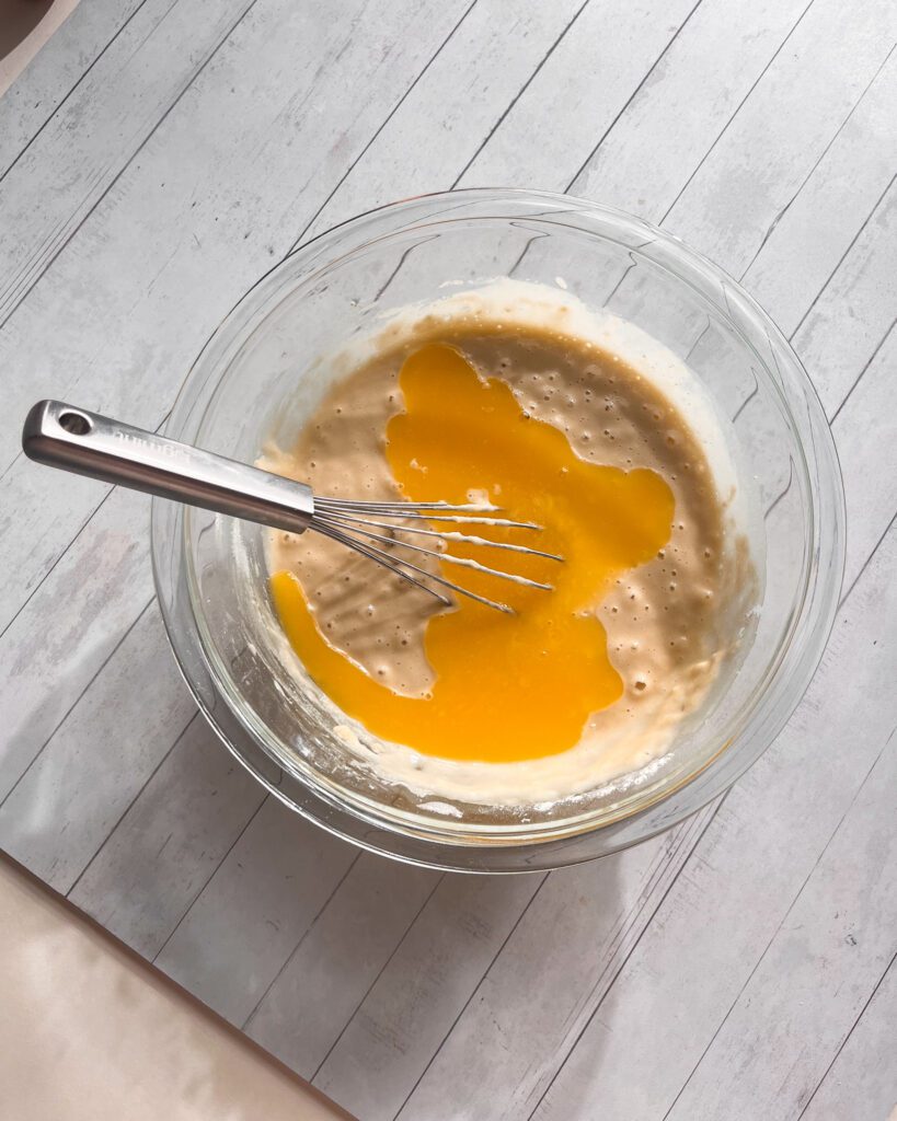 Plain vanilla batter prepared in a mixing bowl for cinnamon coffee cake