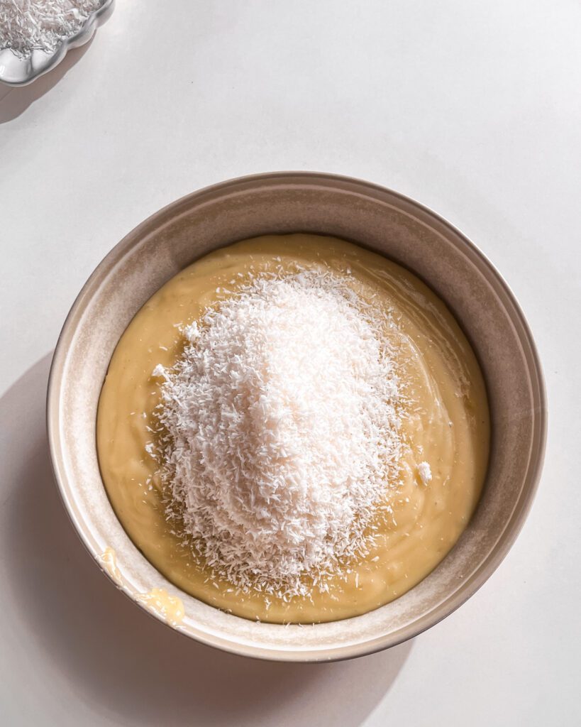 Adding coconut to homemade custard for coconut cream pie