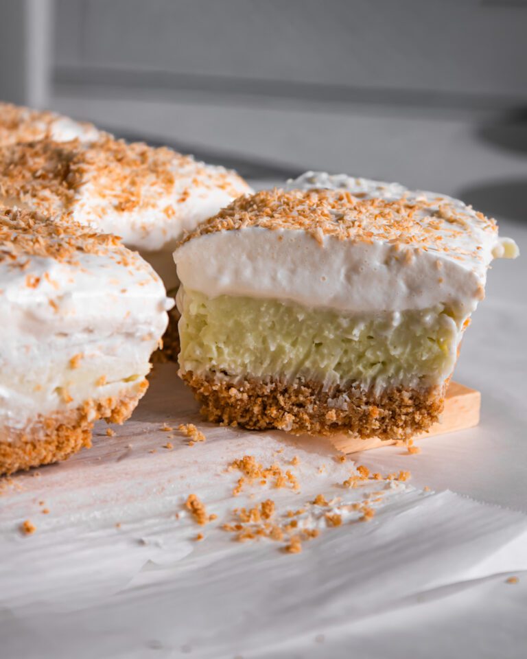 Close-up of a No-Bake Coconut Cream Pie Bar showing the creamy coconut custard layers.