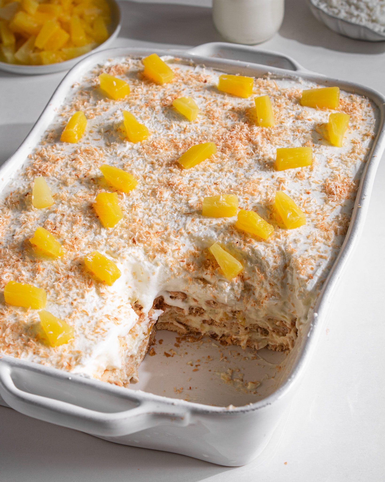 Creamy pineapple coconut biscuit cake with layers of biscuits