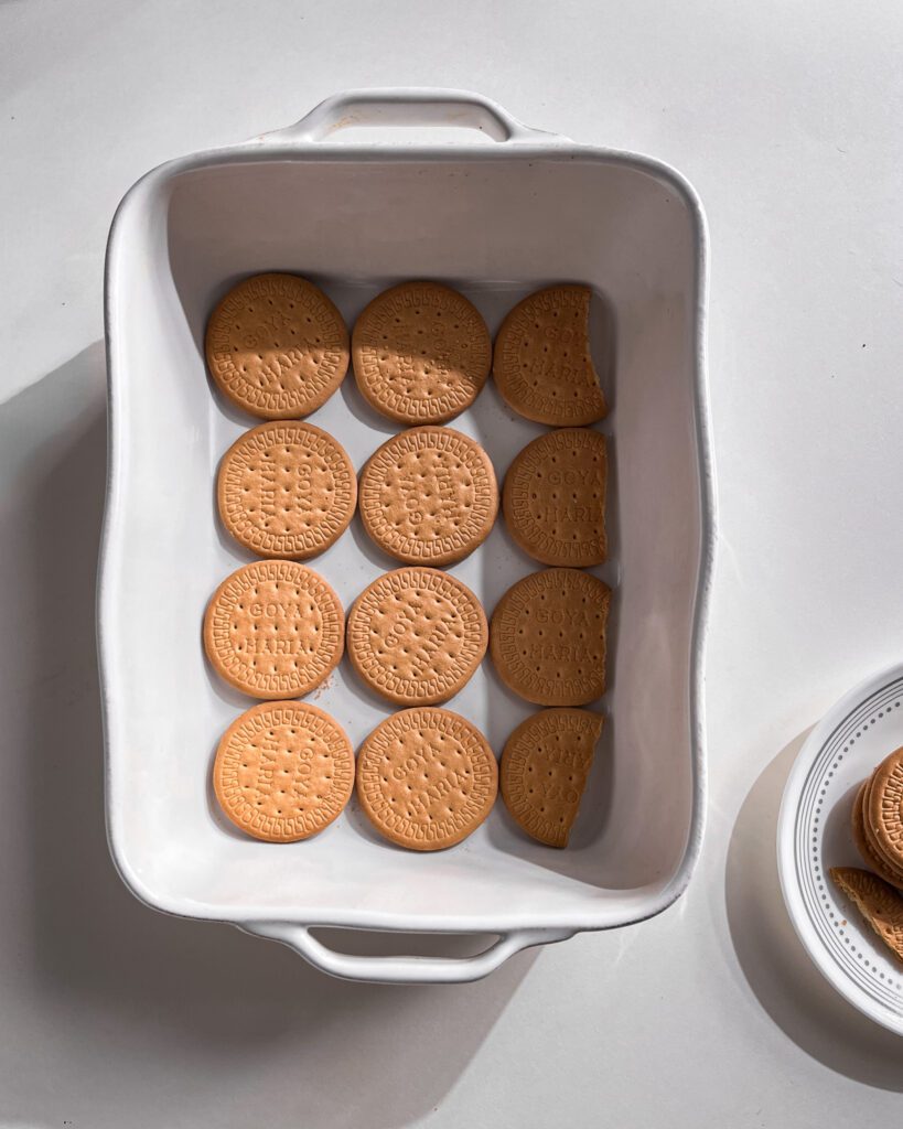 Layering biscuits in a baking dish for icebox cake - carolta