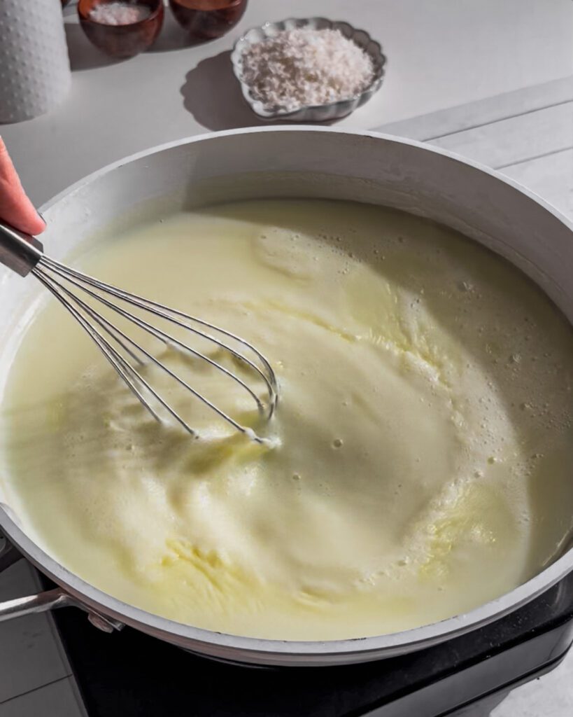 Thick vanilla pudding cooking-in-a-saucepan