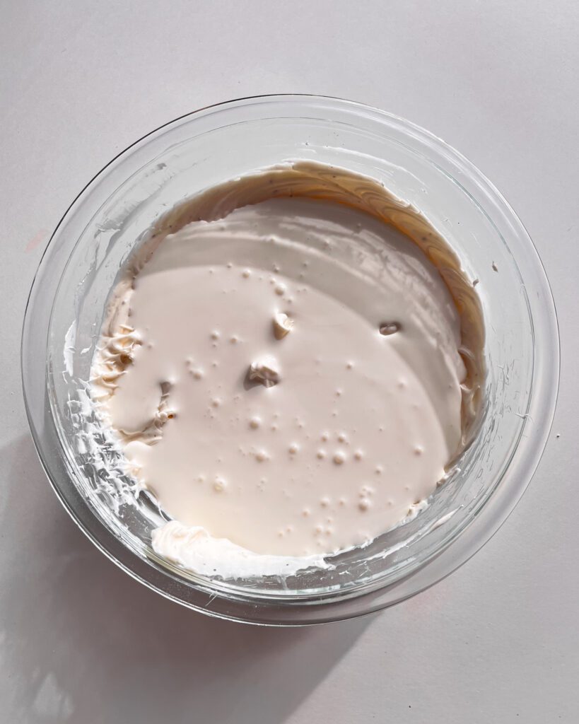 Adding whipping cream to the cream cheese mixture
