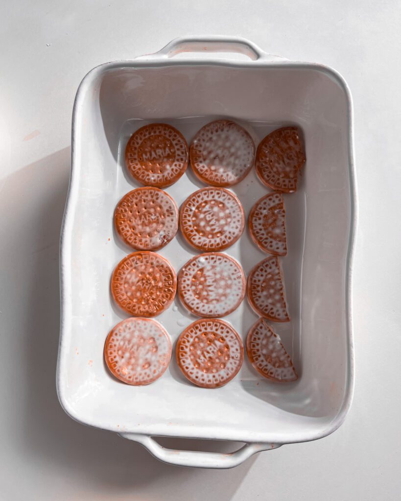 Layering biscuits with fluffy coconut cream