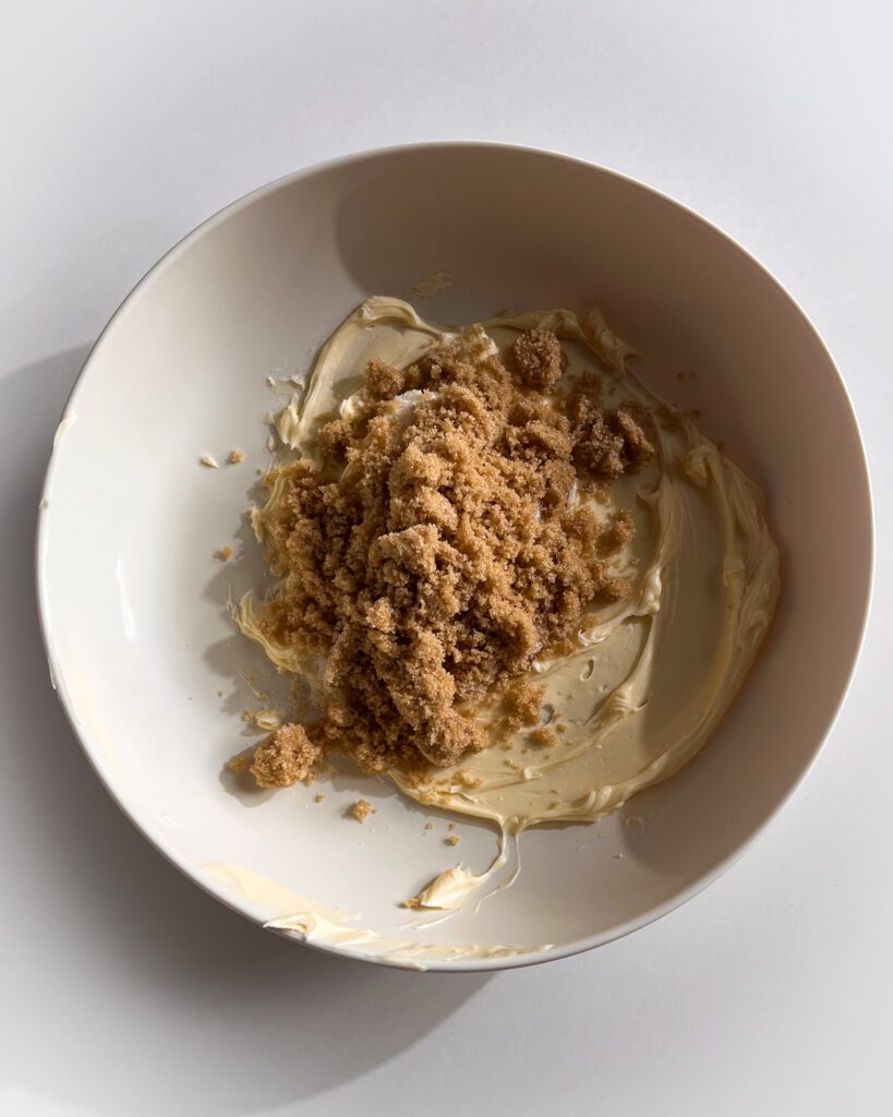 Mixing butter and brown sugar for eggless chocolate chip cookie dough