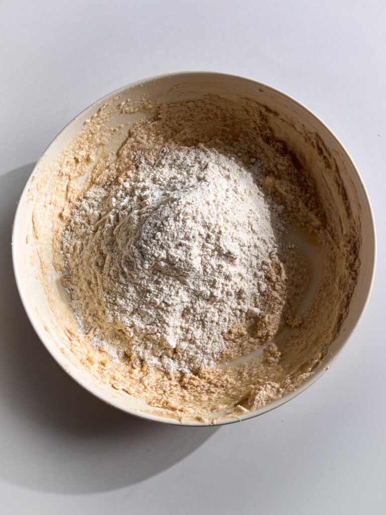 Mixing dry ingredients into eggless cookie dough
