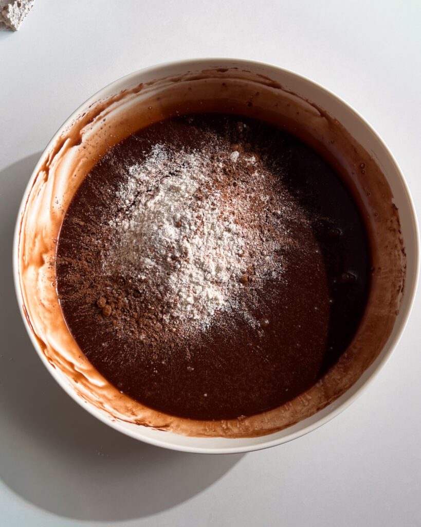 Mixing ingredients for eggless brownie batter