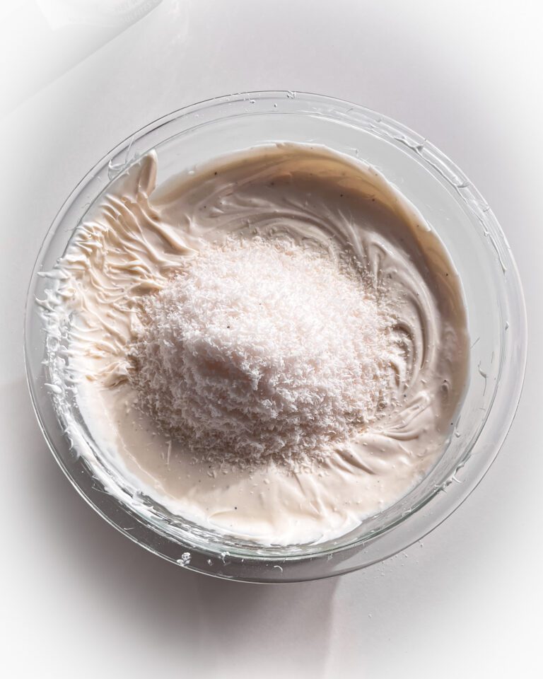 Mixing shredded coconut into the coconut cream filling