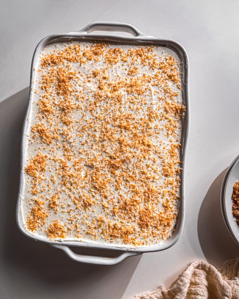 No-Bake Coconut Icebox Cake topped with toasted coconut