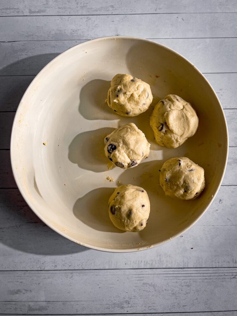 Portioning chocolate chip cookie dough for brookie cookies