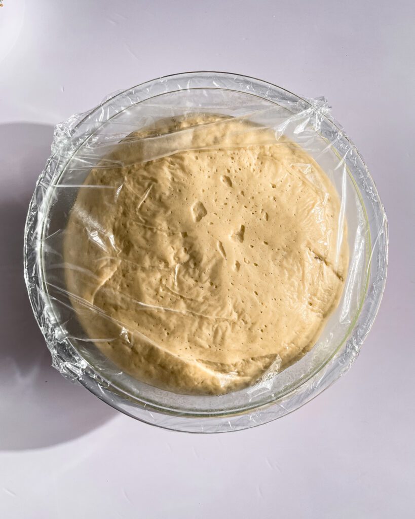Risen cinnamon roll dough ready to roll