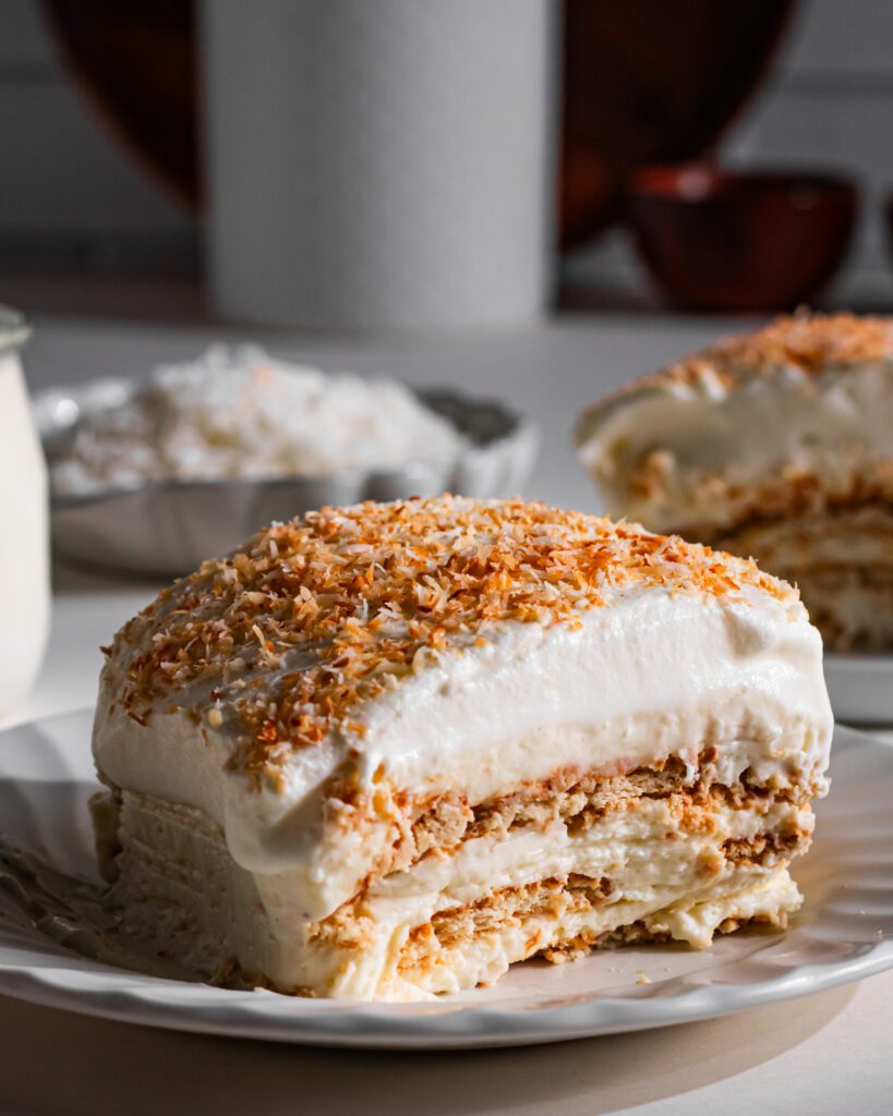 Slice of No-Bake Coconut Icebox Cake on a serving plate