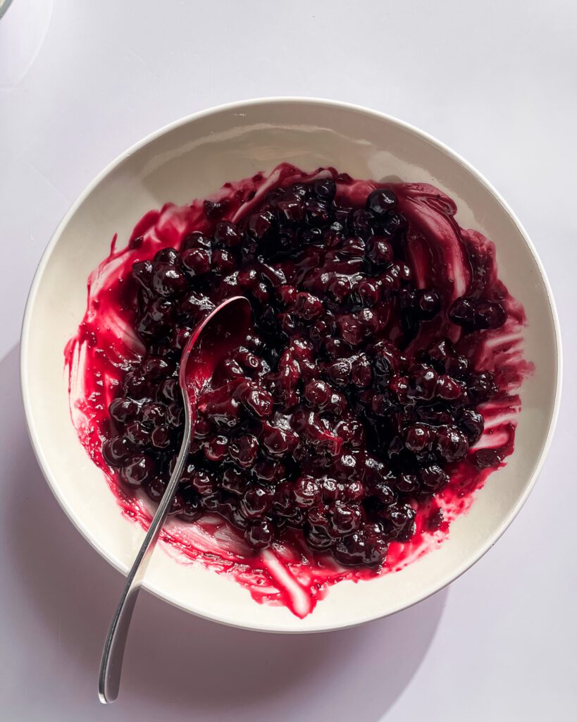 Thick homemade blueberry jam ready for cinnamon rolls