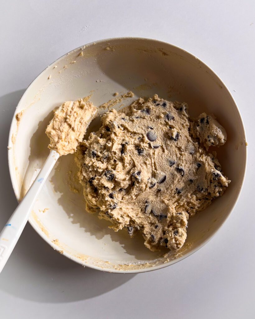 mixing chocolate chip cookie dough for brookie cookies