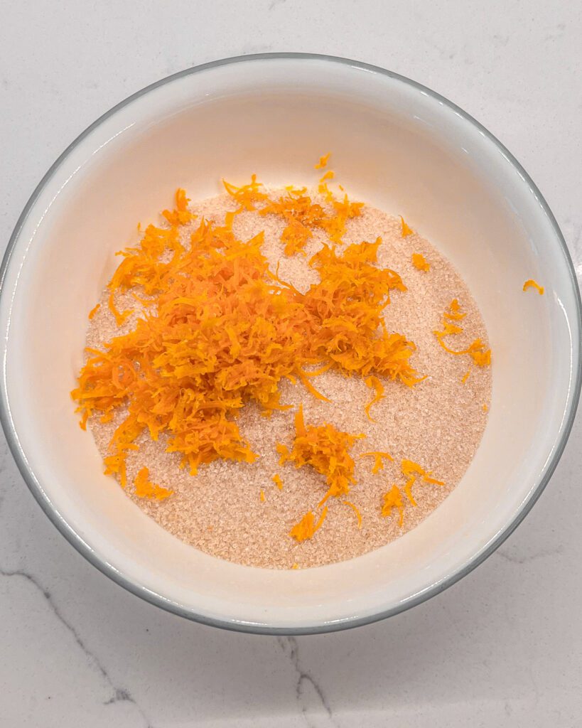orange zest with sugar for orange cranberry cake