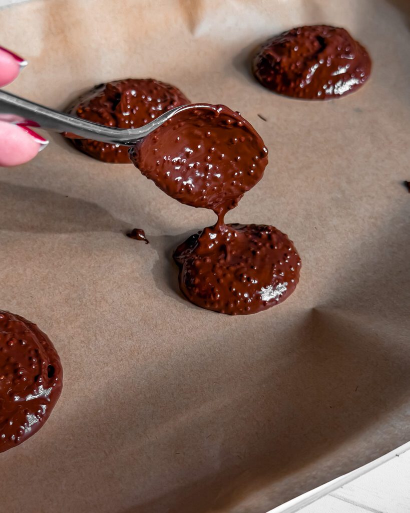 popped quinoa and melted chocolate on a tray